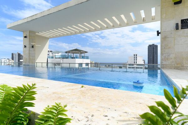 Apartamento en Urbanización Real, Santo Domingo D.N. con 1 habitación, 2 baños, 1 parqueo en 6to nivel de 90 mts² con mantenimiento incluido - Imagen 2